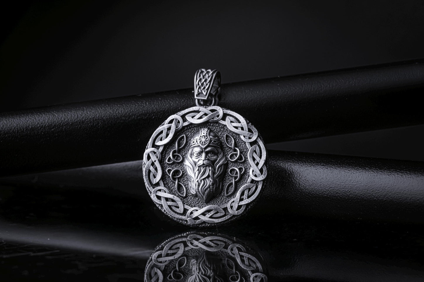 Silver Odin Pendant featuring a detailed Nordic design with an intricate braided border and a bearded Odin face in the center, crafted in polished silver for a striking chain necklace.
