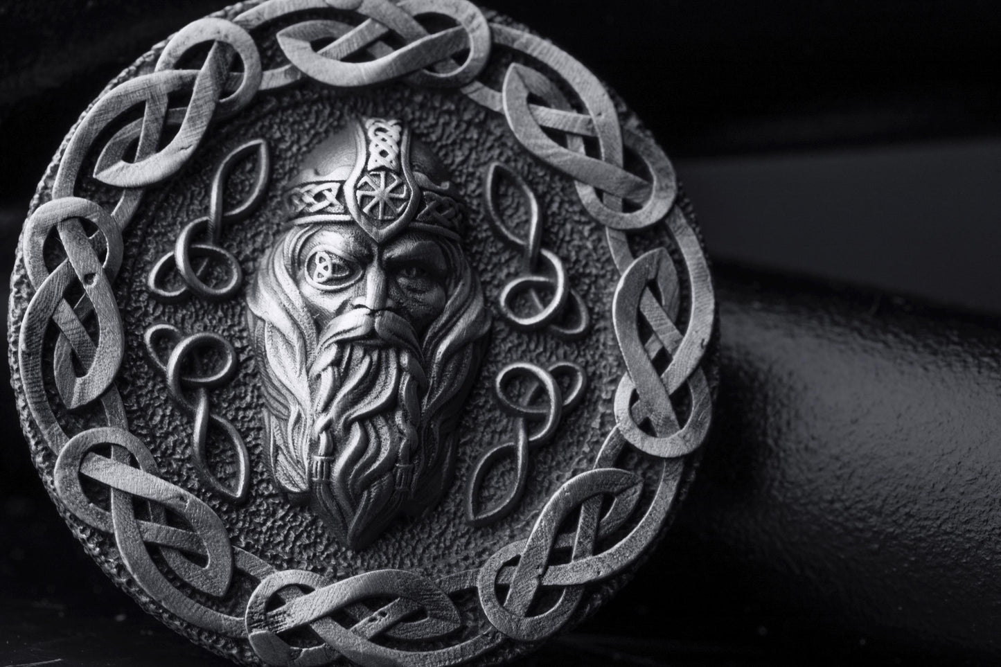 Silver Odin Pendant featuring a detailed depiction of Odin's face surrounded by intricate Celtic knotwork in a round silver design, showcasing expert craftsmanship and Norse mythology inspiration.