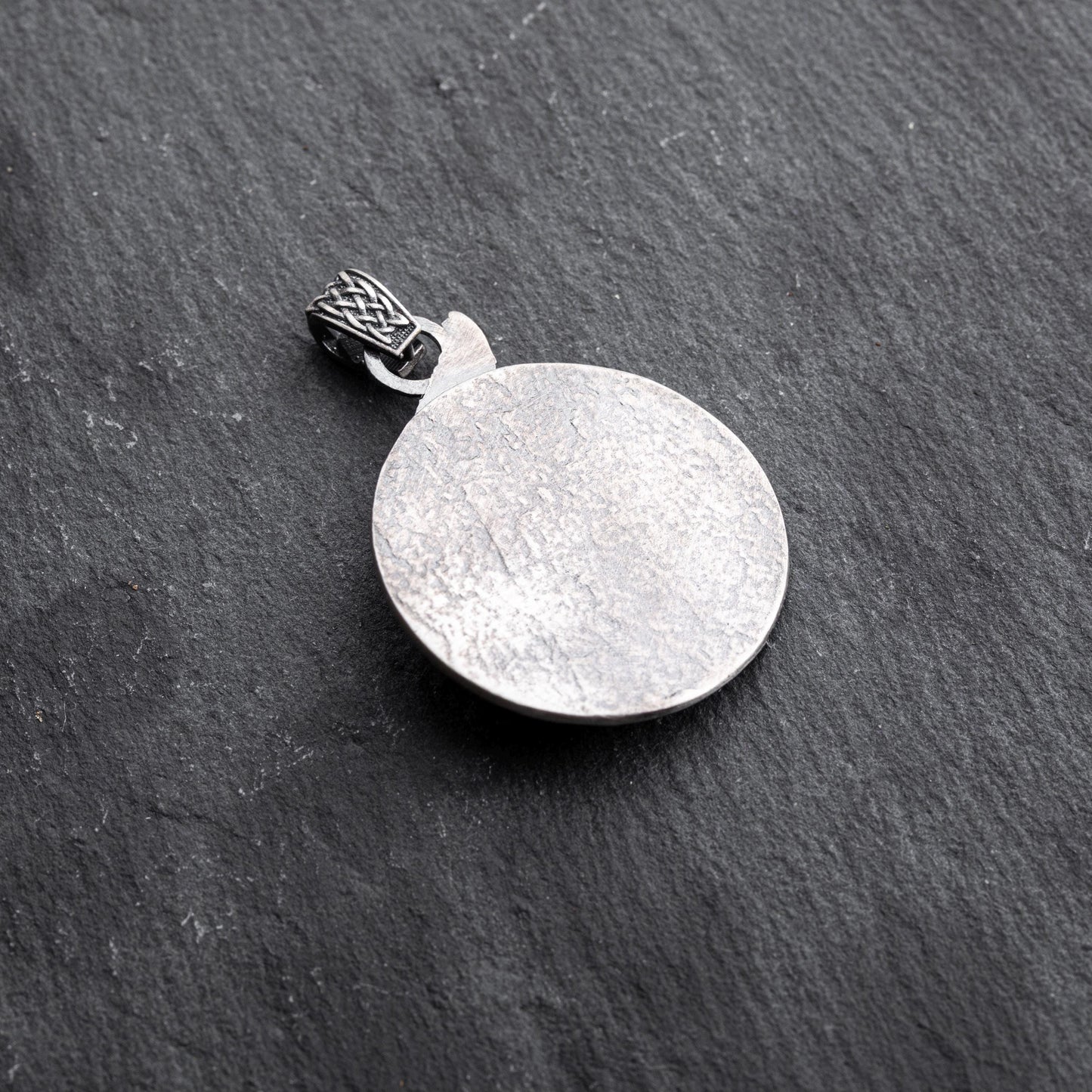 Gladiator Pendant featuring a textured round silver design with a detailed bail, perfect for adding a subtle yet stylish touch to chain necklaces or silver jewellery collections.