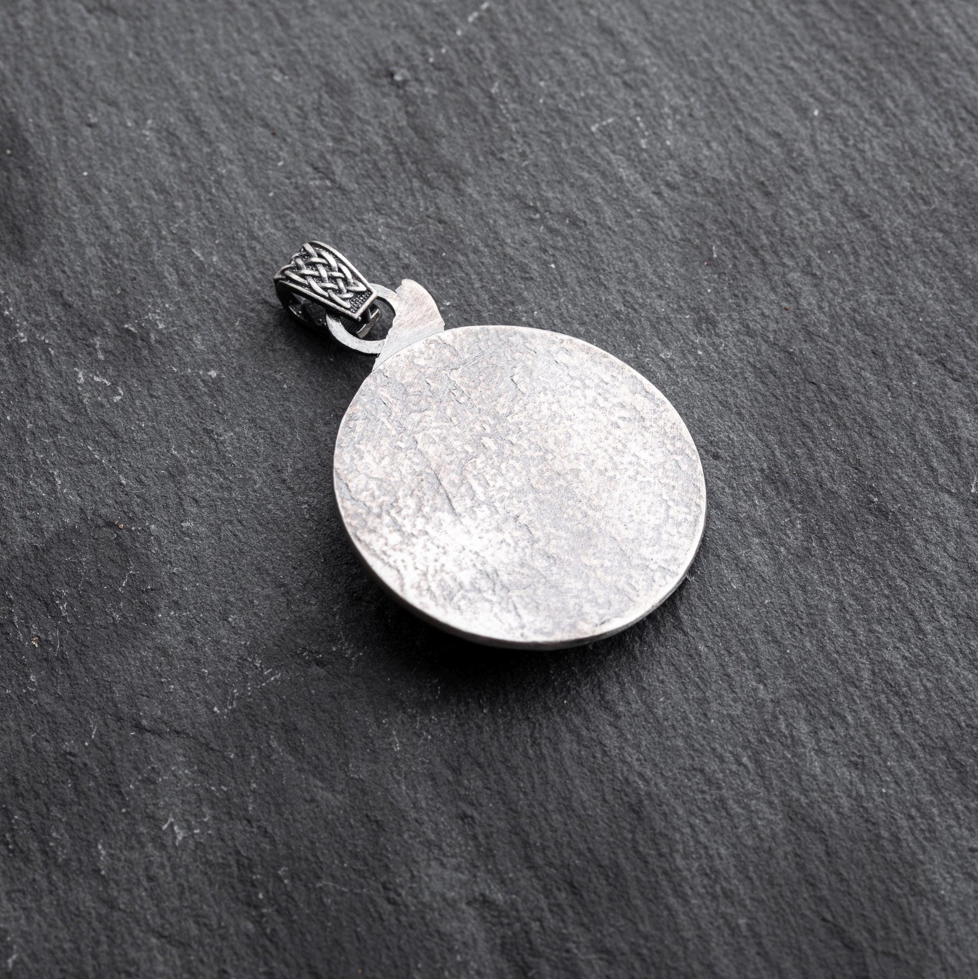 Gladiator Pendant featuring a textured round silver design with a detailed bail, perfect for adding a subtle yet stylish touch to chain necklaces or silver jewellery collections.