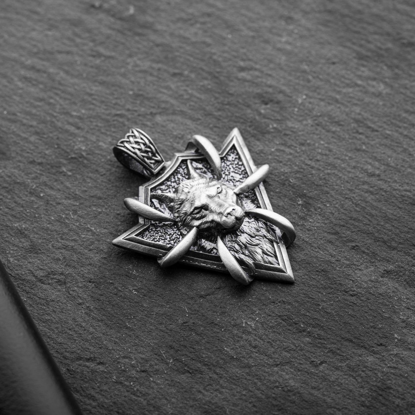 Sterling Silver Arrowhead Wolf Pendant featuring a detailed wolf head design with claw accents on a textured arrowhead background, crafted from silver jewelry.