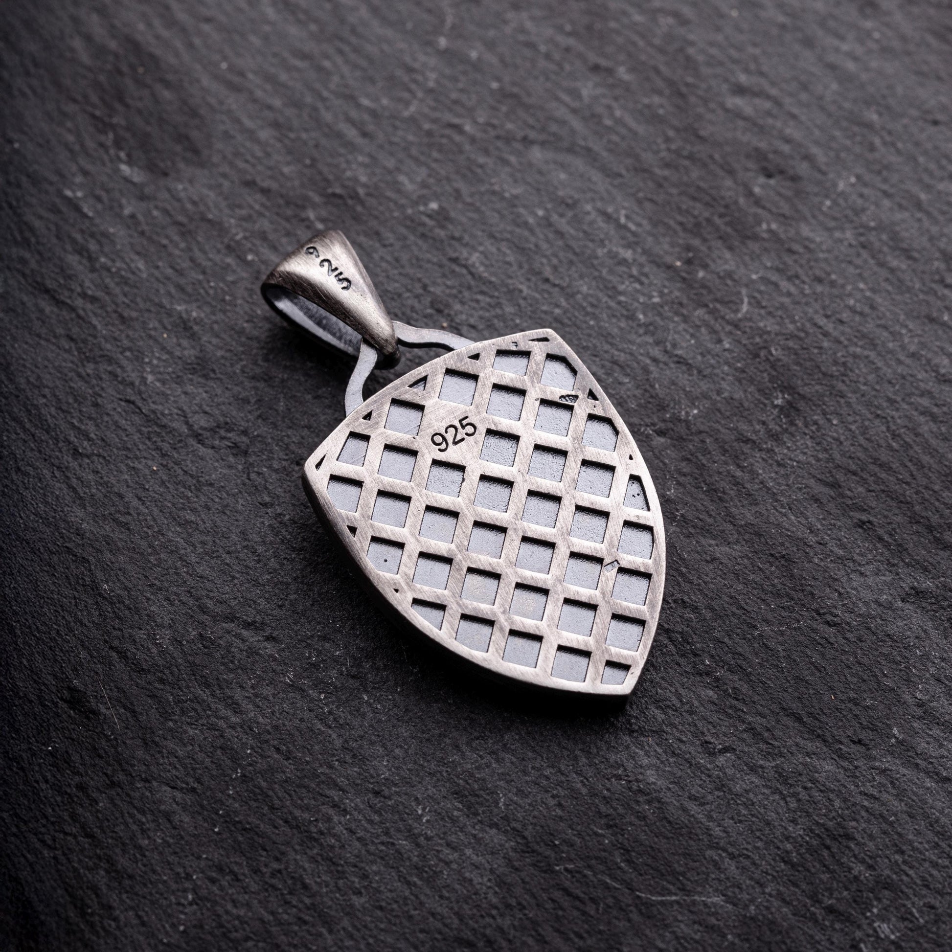 Aries Ram Pendant made of sterling silver with a detailed lattice pattern on the back, showcasing a 925 purity stamp for authenticity.