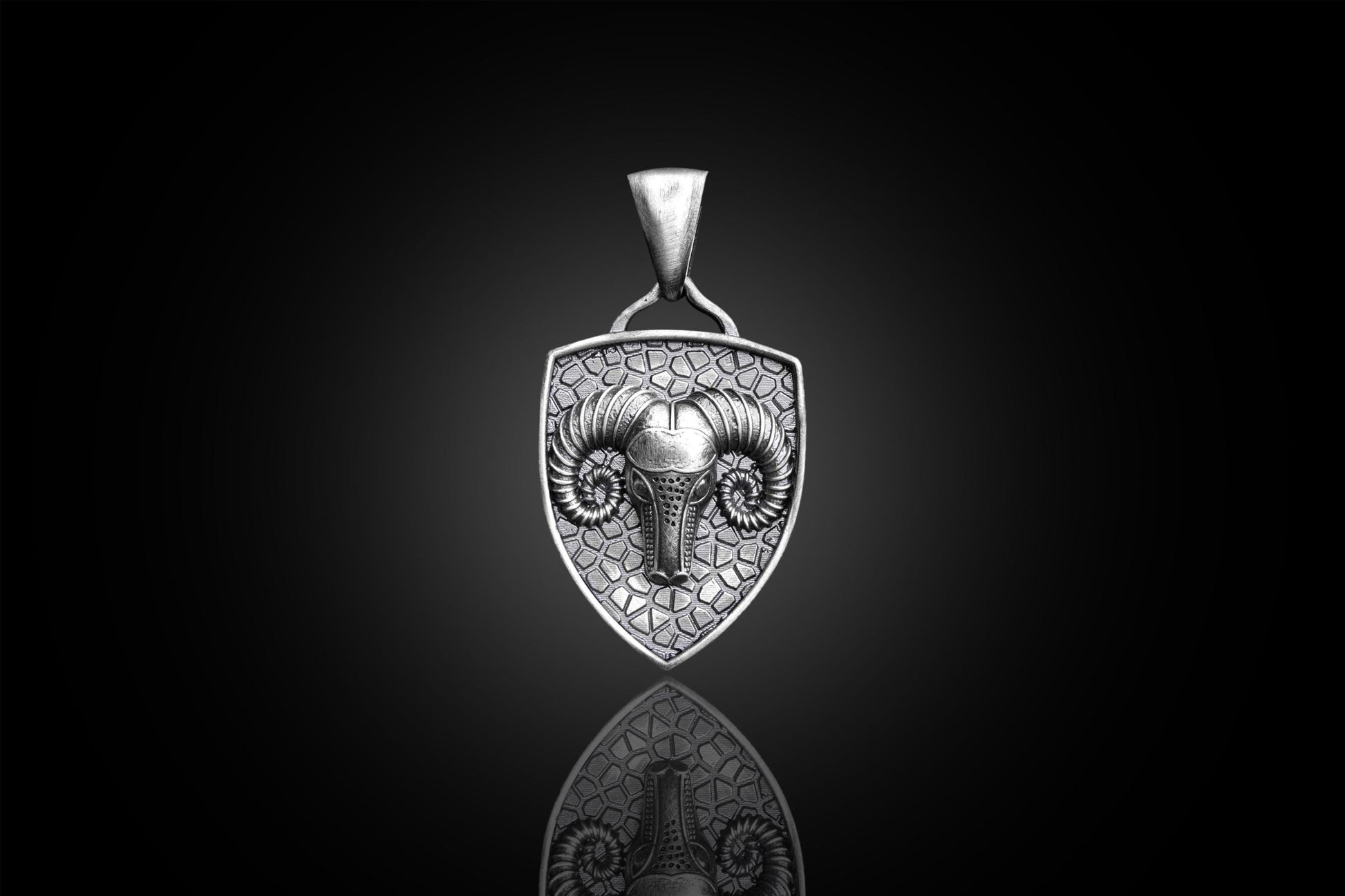 Aries Ram Pendant featuring a detailed ram head design on a textured shield-shaped silver pendant, perfect for those seeking unique silver jewellery.