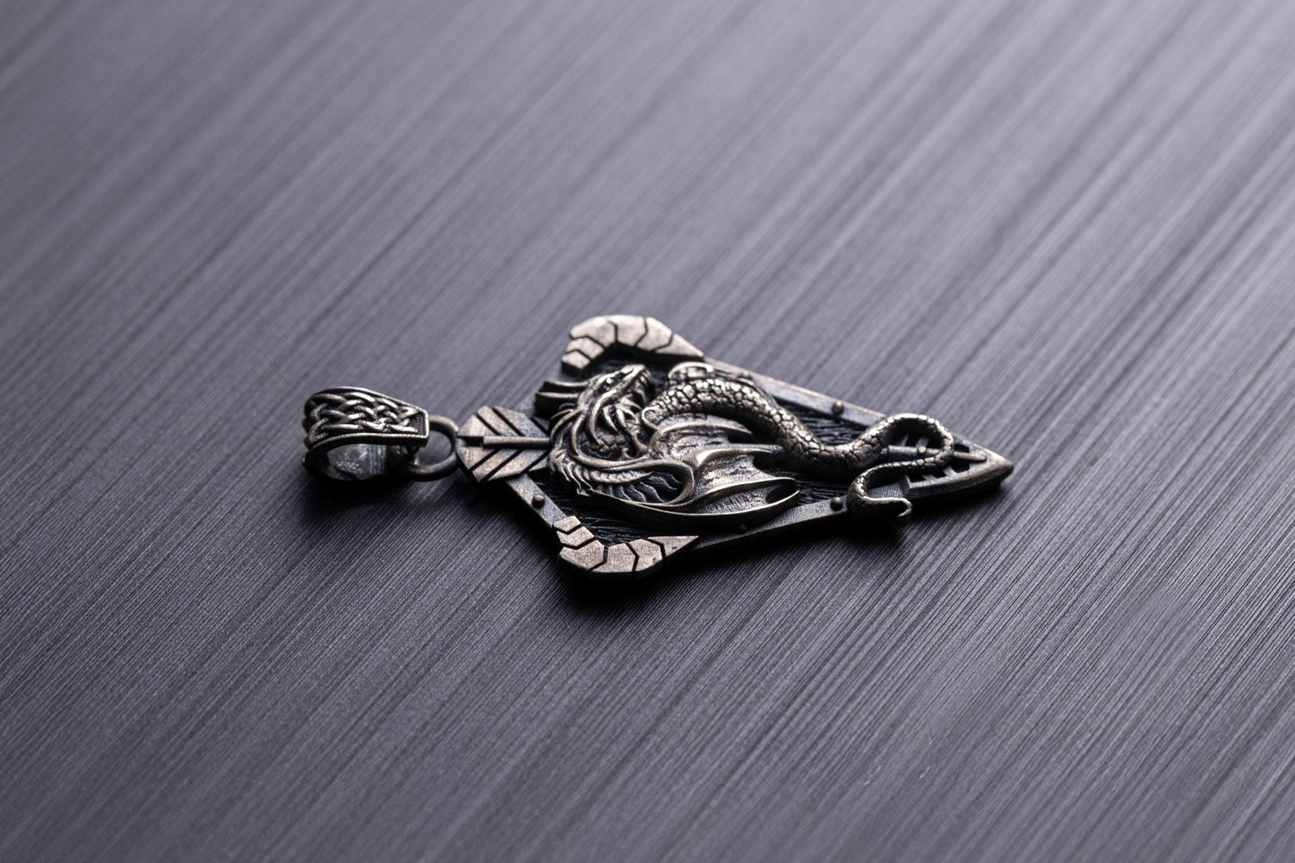 Sterling Silver Dragon Arrowhead Pendant featuring an intricately detailed dragon wrapped around an arrowhead design, crafted in silver jewelry style for a bold chain necklace accessory.