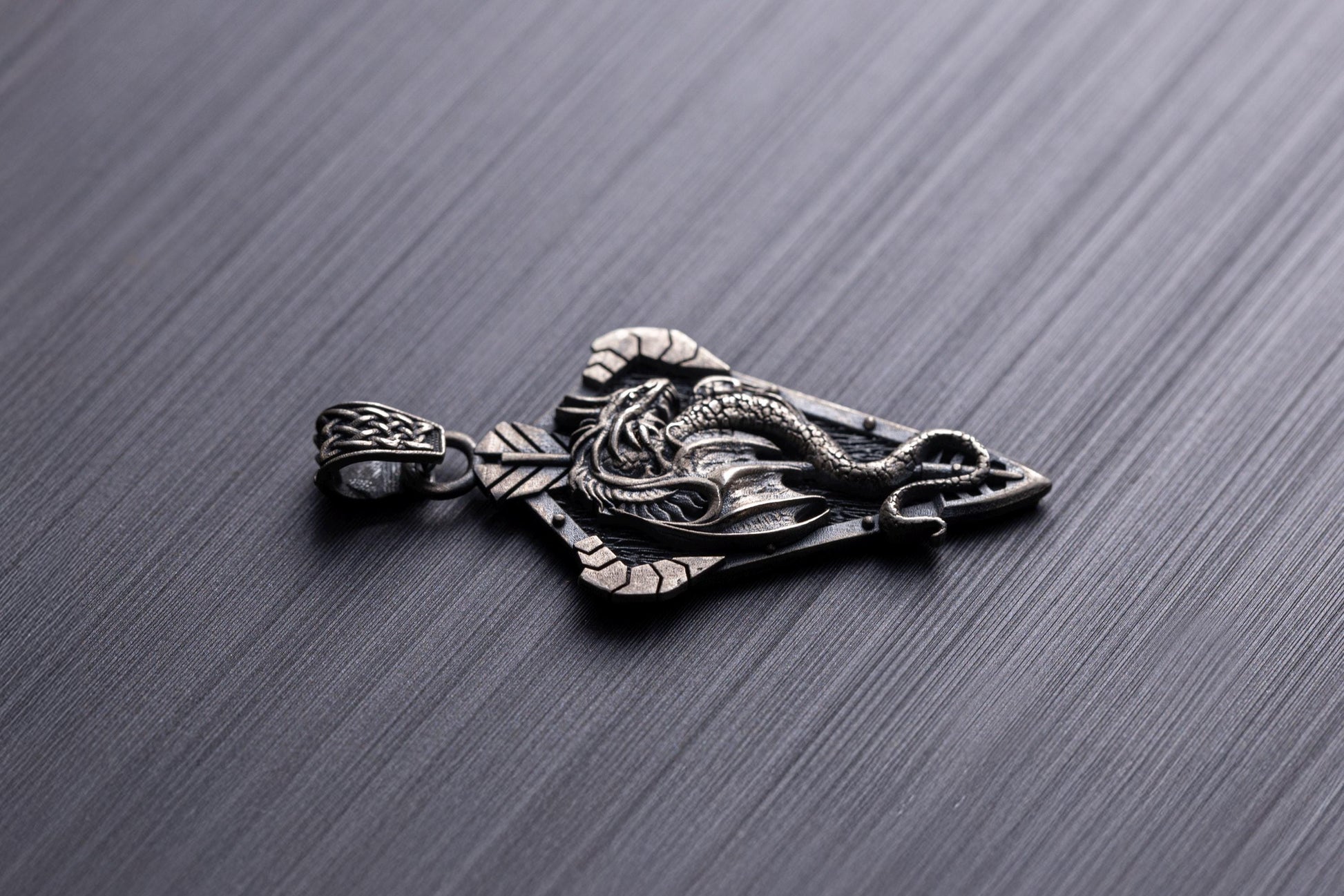 Sterling Silver Dragon Arrowhead Pendant featuring an intricately detailed dragon wrapped around an arrowhead design, crafted in silver jewelry style for a bold chain necklace accessory.
